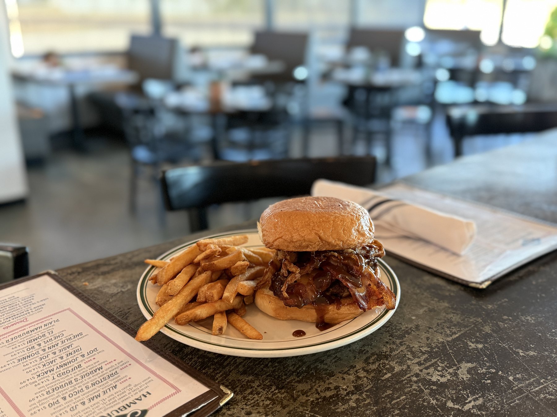 The Buford T burger and fries on the counter at JD’s