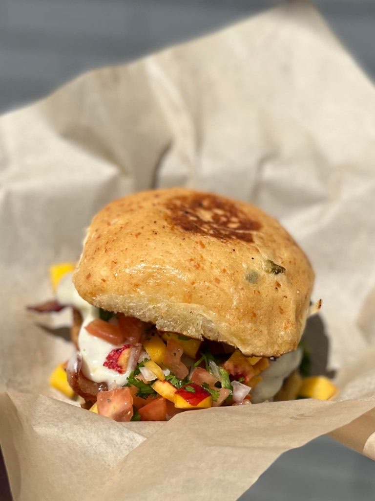 The Sherlie Ann and Donnie burger with bacon, peach pico de gallo, and Swiss