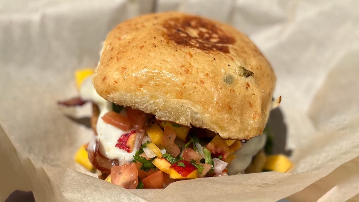 The Sherlie Ann and Donnie burger with bacon, peach pico and Swiss